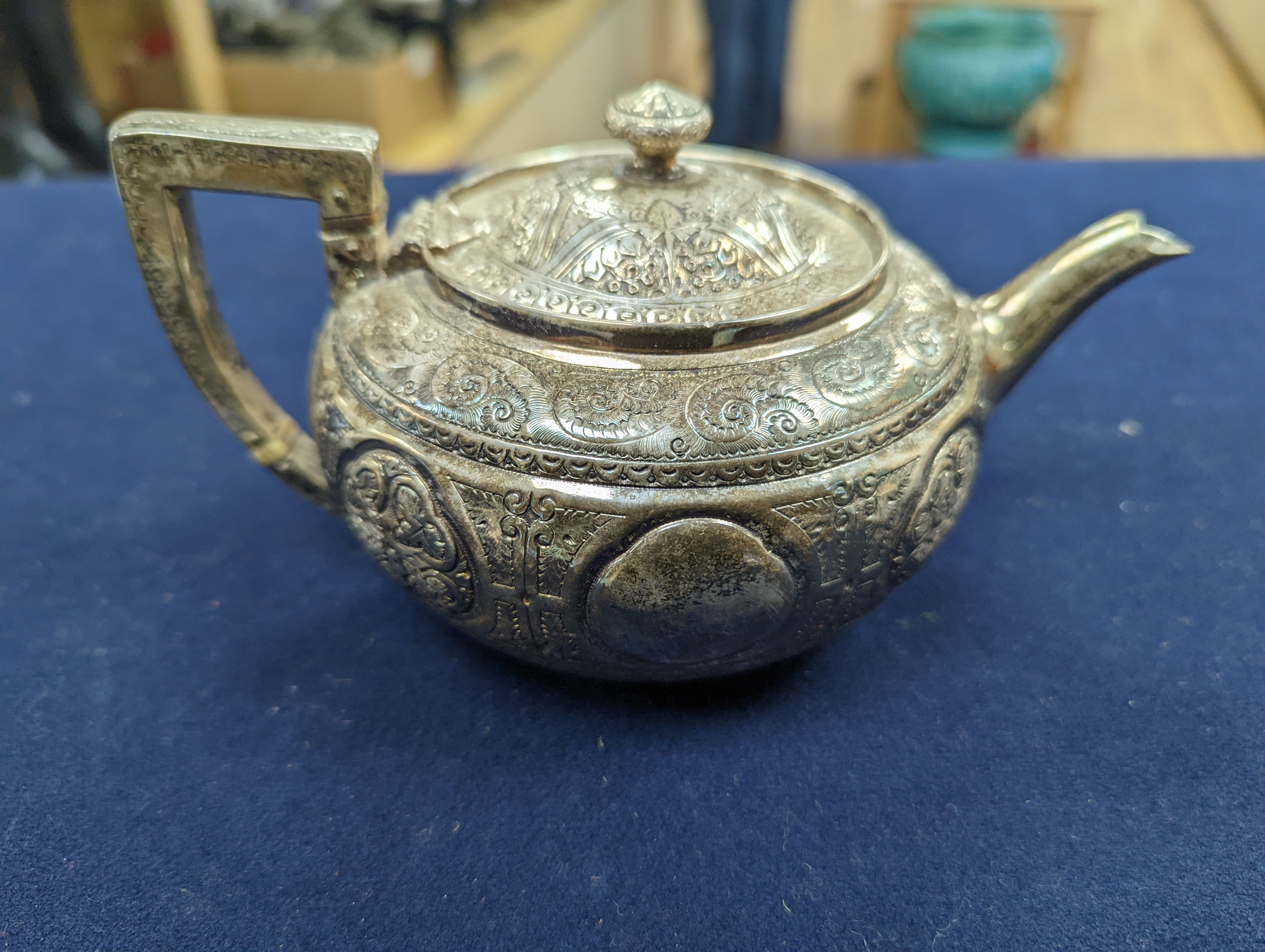 A WMF dish, Islamic white metal mounted photo album and a plated teapot and jug